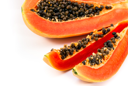 Papaya fruit sliced on half isolated on a white background.の写真素材
