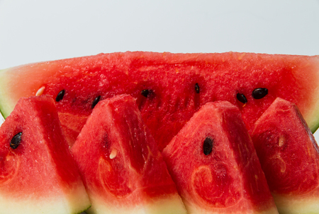 Slices of watermelon on white background