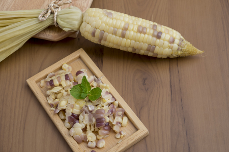 White corn on old wooden tableの写真素材