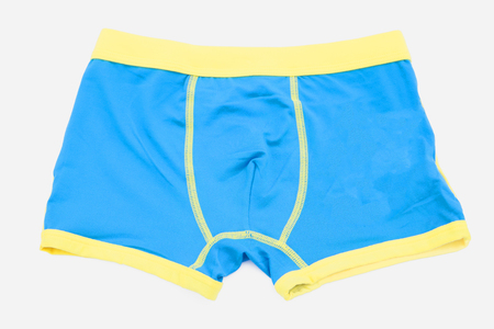 Children's orange swimming shorts isolated on white background with clipping path.