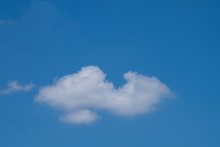 White cumulus clouds and a blue sky.の写真素材