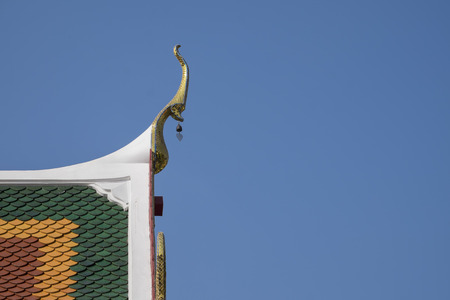 Beautiful gable apex on the roof of buddhist temple.