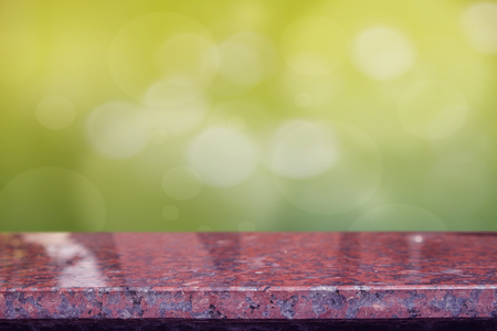 Brown quartz stone countertop on bokeh green background - can be used for display or montage your productsの写真素材