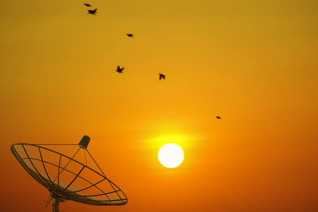 Satellite dishes. Sunset sky backgroundの写真素材