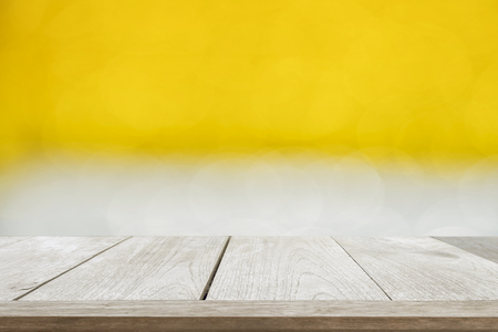 Wood table top on abstract gold bokeh, Christmas concept.の写真素材