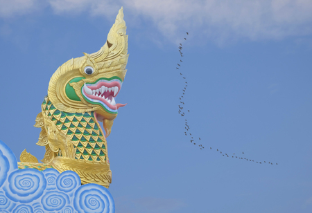 Naga statue head  with blue sky backgroundの写真素材