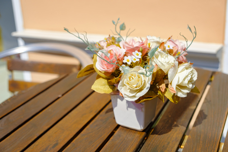 colorful flowers pots decoration on wooden tableの写真素材