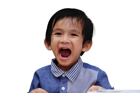Portrait of happy smiling boy on isolated backgroundの写真素材