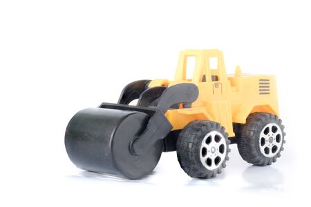 Toy Heavy Machinery.Road roller on white background.の写真素材