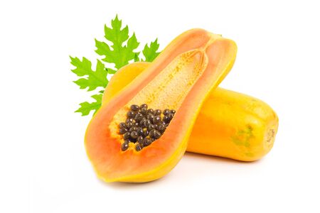 Whole and half of ripe papaya fruit with seeds on white backgroundの写真素材