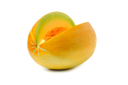 Sliced cantaloupe thai tropical fruit asian on white background. Thai Melon, The inside of the fruit is light yellow-green in color and has many berries in the form of cream.の写真素材