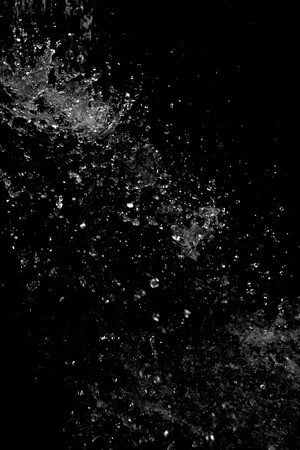 Water splash on black backgroundの写真素材