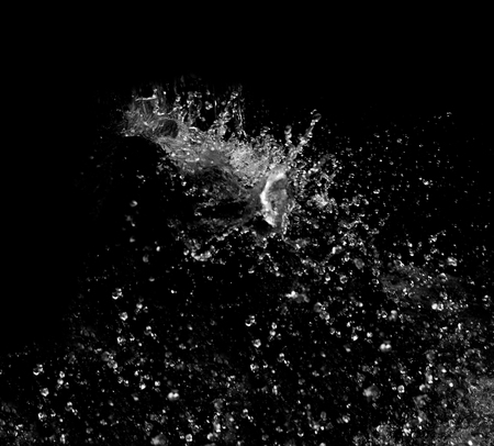 Water splash on black backgroundの写真素材