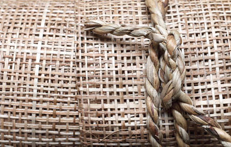 traditional thai style pattern nature background of decorative brown handicraft weave texture wicker surface for furniture materialの写真素材