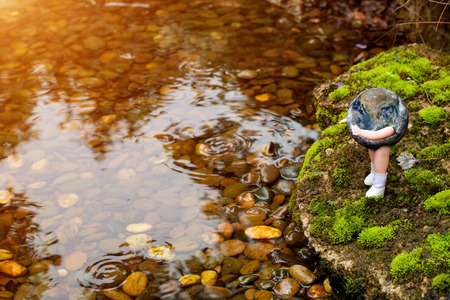 baby globe in park .の写真素材