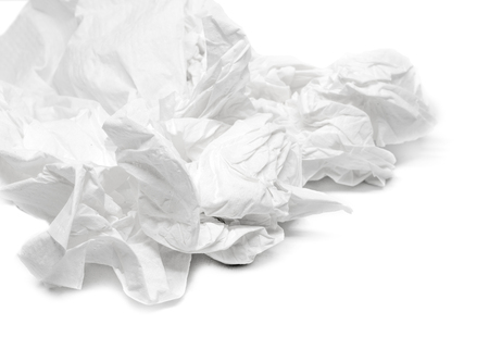 used screwed paper tissue isolated on white backgroundの写真素材
