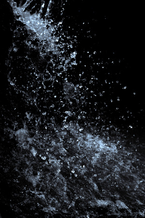 Water splash on black backgroundの写真素材