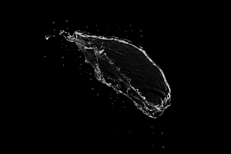 water splash isolated on black backgroundの写真素材