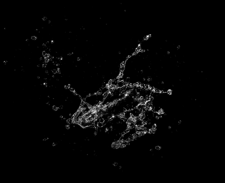 water splash isolated on black backgroundの写真素材