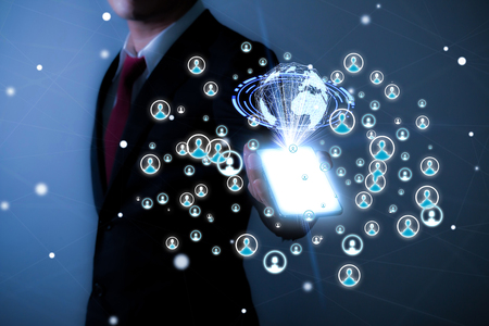 Businessman on blurred background using social network interface 3D renderingの写真素材