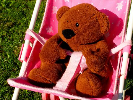 teddy bear in buggyの写真素材