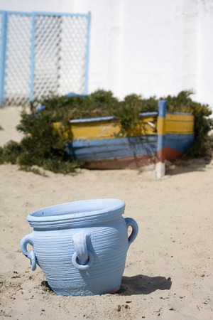 Close-up of blue vase on the beachの写真素材