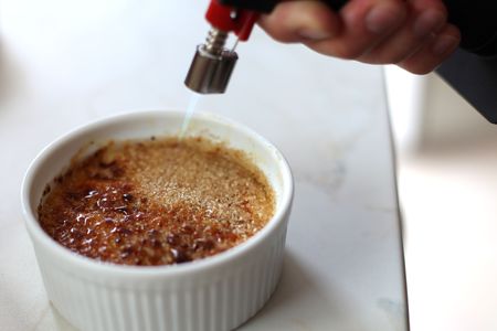 creation of flambe creme brulee, fire burnerの写真素材