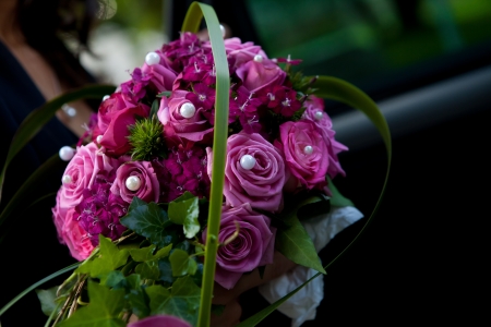 purple bouquet with silver pearls and some greenの写真素材
