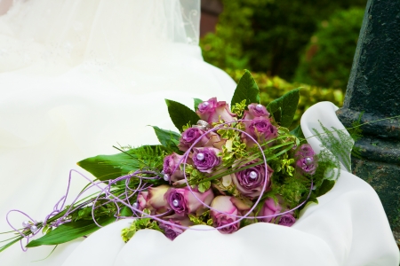 purple bouquet is laying down on the white trailの写真素材