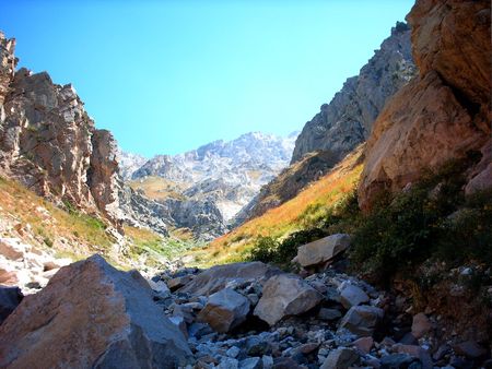 Dark and light slopes on mountain range background. Uzbekistan, fall 2004の写真素材