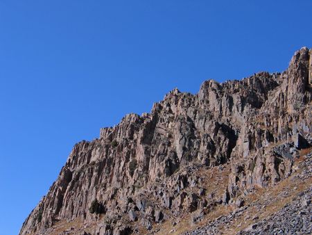 Grey rocks on blue sky background. Uzbekistan, fall 2007の写真素材