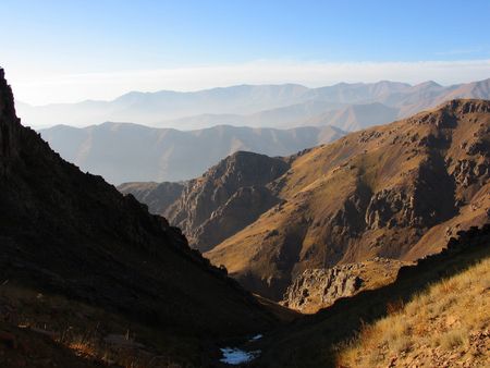 Dark and light slopes on mouantain range background. Uzbekistan, fall 2007の写真素材