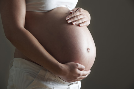 Low Key Image Of Pregnant Womanの写真素材