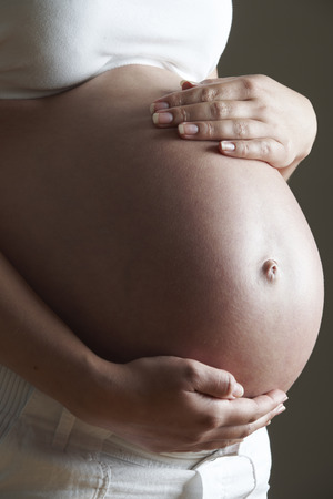 Low Key Image Of Pregnant Womanの写真素材
