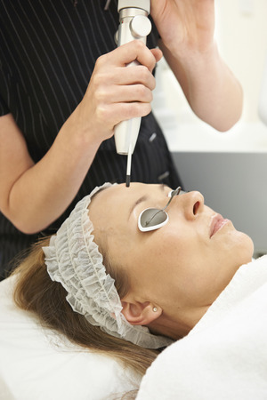 Woman Having Skin Rejuvenating Laser Treatment In Clinicの写真素材