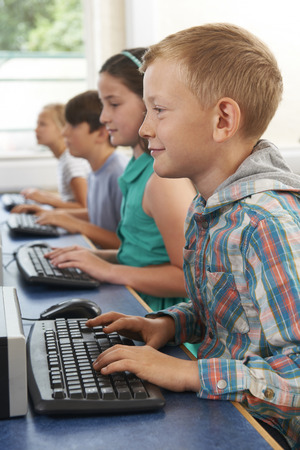 Group Of Elementary School Children In Computer Classの写真素材