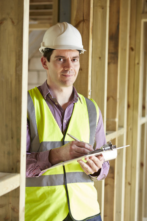 Building Inspector Looking At New Propertyの写真素材