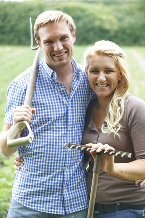 Farmer and wife smilingの写真素材