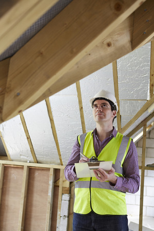 Building Inspector Looking At New Propertyの写真素材