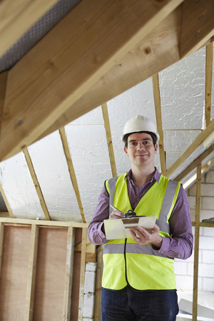 Building Inspector Looking At New Propertyの写真素材