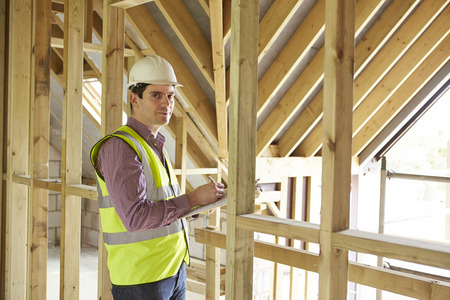 Building Inspector Looking At New Propertyの写真素材