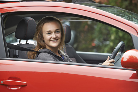 Female Teenage Driver Looking Out Of Car Windowの写真素材