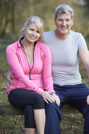 Mature Couple Exercising In Countryside Togetherの写真素材