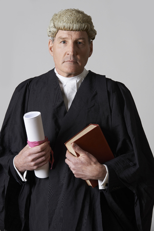 Portrait Of Male Lawyer Holding Brief And Bookの写真素材