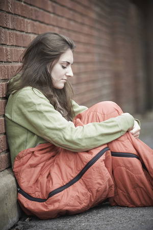 Vulnerable Teenage Girl Sleeping On The Streetの写真素材