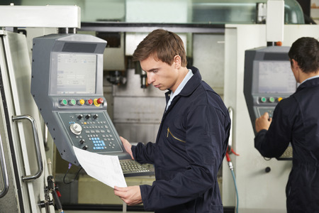 Engineer Operating Computerized Cutting Machine