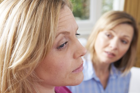 Unhappy Woman In Conversation With Friend Or Counsellorの写真素材