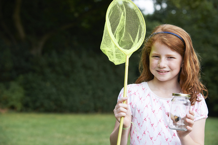 Girl With Net and Butterfly In Glass Jarの写真素材