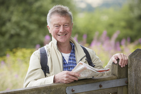 Senior Man Hiking In Countrysideの写真素材