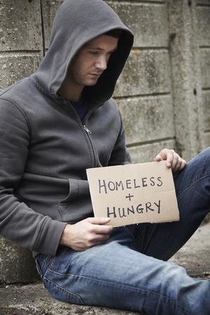 Homeless Young Man Begging On The Street